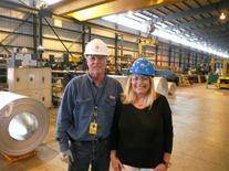 Alan Richardson inspects Painted Galvalume Steel Coils with Lana Keeton