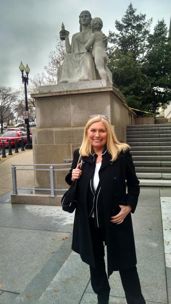 Lana Keeton in front of statue, Spirit of Justice,  at Rayburn House Office Building,  Washington,  D.C. Dec 3, 2014